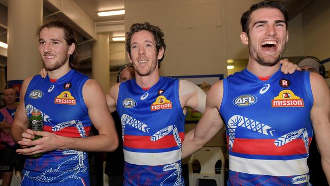 Marcus Bontempelli, Bob Murphy and Easton Wood celebrate a win earlier this year.