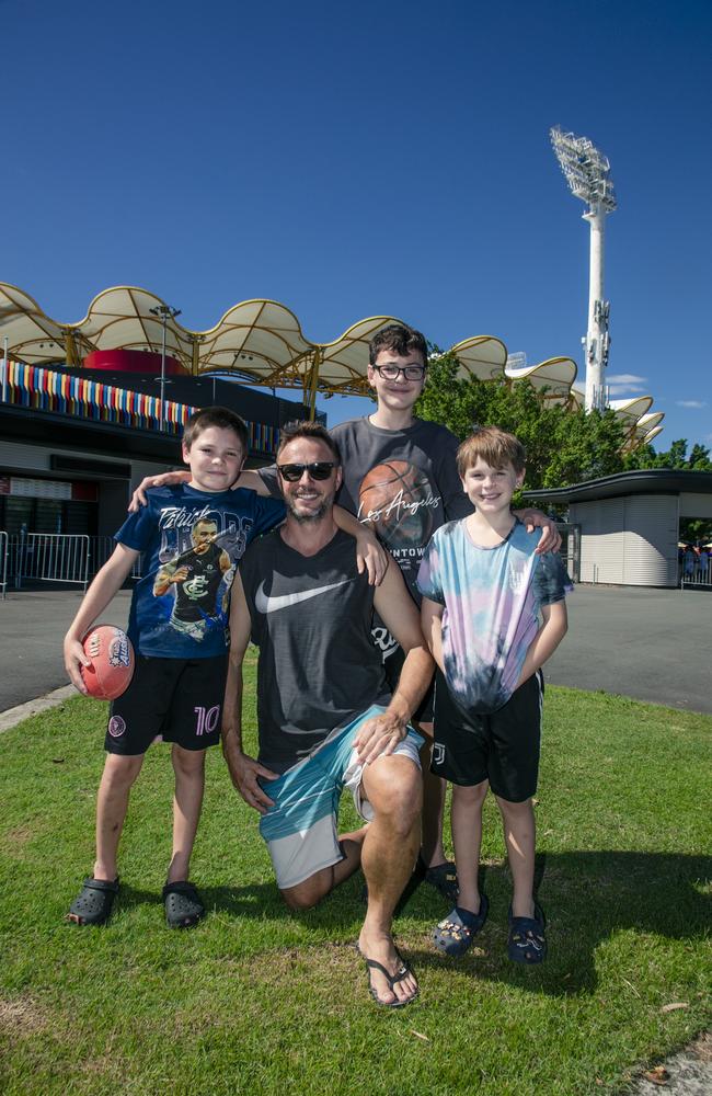 Pete Wendhausen takes his sons, Elijah, Jordan, and Brayden as the Gold Coast Swans take on the Sydney Swans at People First Stadium, Carrara. Picture: Glen Campbell