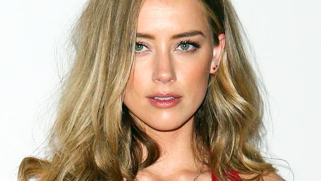 Amber Heard says her divorce is about domestic violence, not money.