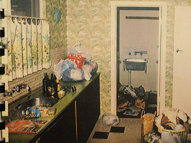 A crime scene photo showing mess and bags of personal possessions in the kitchen of the Somerville Ave home. Picture: Supplied