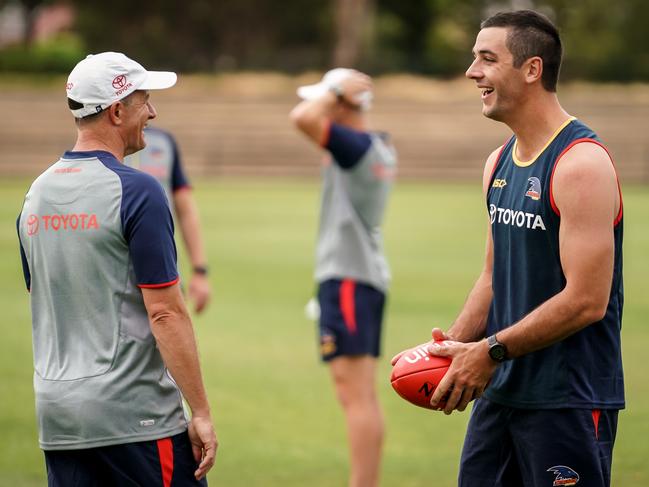 Don Pyke chats with Taylor Walker at Crows training. Picture: AAP/MIKE BURTON