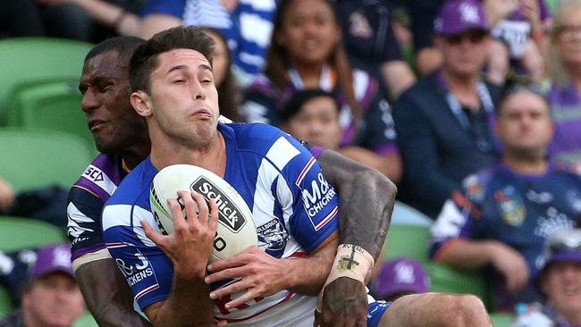 Vunivalu gets to grips with Nick Meaney. Image: AAP Image/Hamish Blair