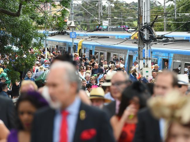 Thousands of race goers arrive to Flemington by train. Picture: Jake Nowakowski