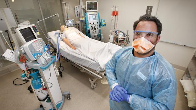 Nurse educator Travis Bird at an intensive-care bed in The Alfred Hospital in Melbourne. Picture: David Caird