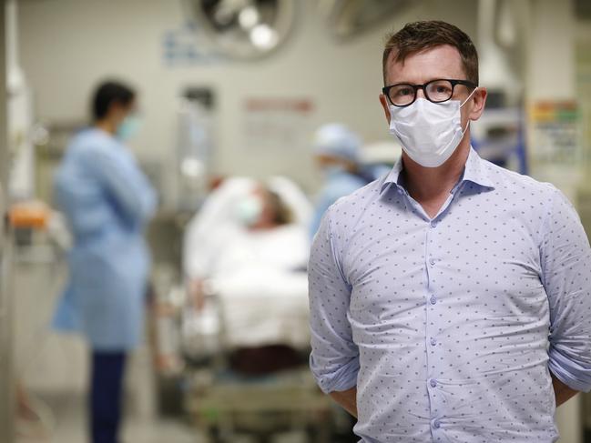 Royal Melbourne Hospital Emergency Department director Mark Putland says all emergency medical staff have to wear face masks. Picture: David Caird