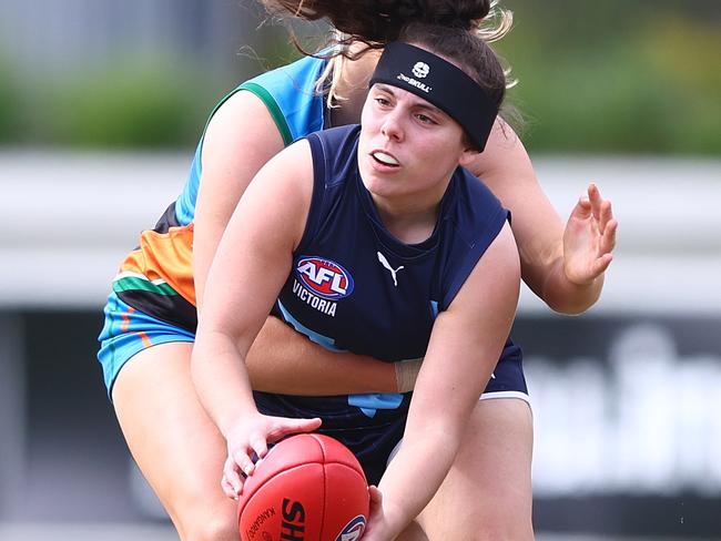 BRISBANE, AUSTRALIA - JULY 02: Ava Jordan of Vic Metro handballs during the 2023 AFL National Championships U18 Girls match between Allies and Vic Metro at Brighton Homes Arena on July 02, 2023 in Brisbane, Australia. (Photo by Chris Hyde/AFL Photos/via Getty Images )