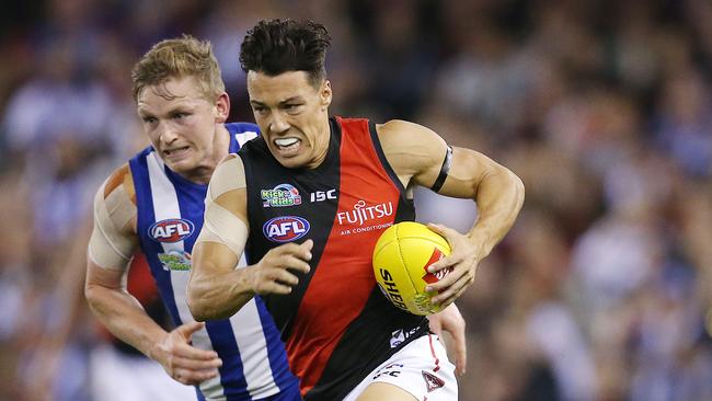 Dylan Shiel charges clear of North Melbourne captain Jack Ziebell. Picture: Michael Klein.