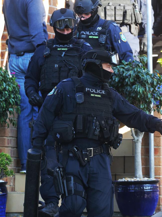 Police raid a Yagoona home. Picture: John Grainger