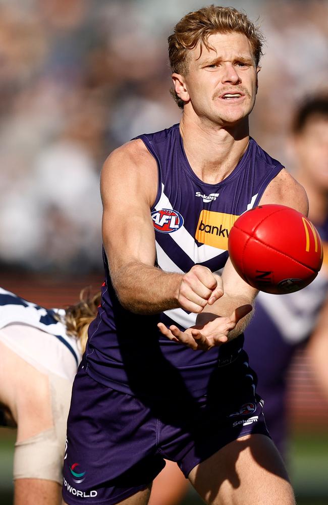 Corey Wagner fires off a handball. Picture: Michael Willson/AFL Photos