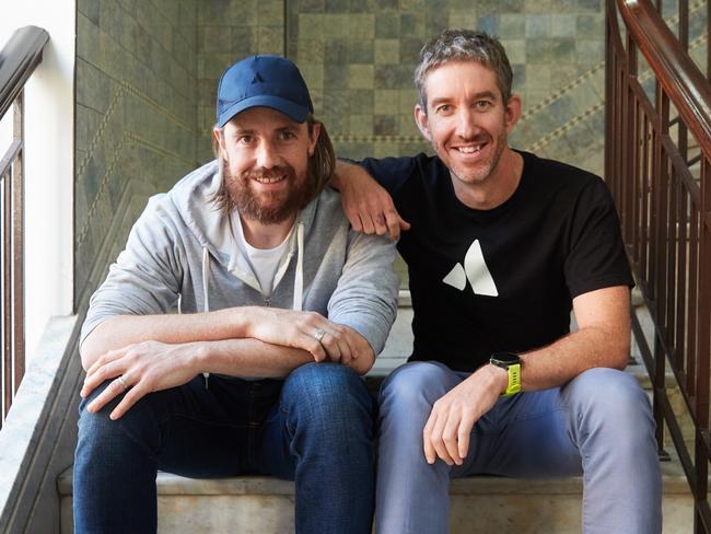 Mike Cannon-Brookes (baseball cap) and fellow founder of Atlassian, Scott Farquhar pictured together in their Sydney HQ