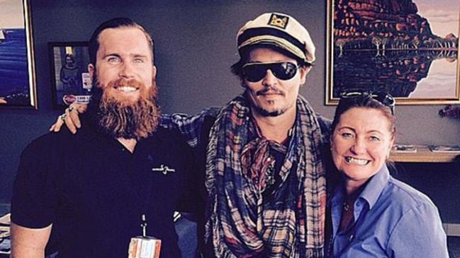 Johnny Depp gets nautical in Brisbane as he poses with a barber who trimmed his hair and beard. Picture: Instagram.