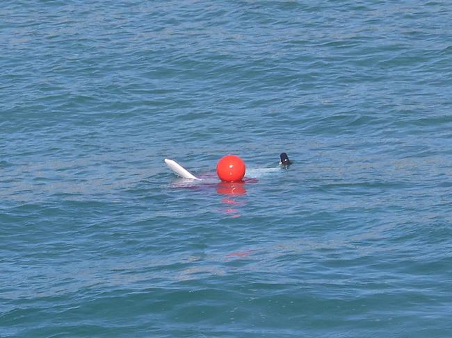 Photos of the scene of the police operation to recover a microlight aircraft which crashed in the sea south of Nambucca Heads yesterday. Two people died when the aircraft crashed about 4pm (Saturday 4 January 2024), into the ocean about 1km east of Gumma. Picture is the Cockpit tied to a  red flotation buoy tethered to the beach via a rope. The undercarriage (wheels) are still attached to the cockpit. Picture: Supplied