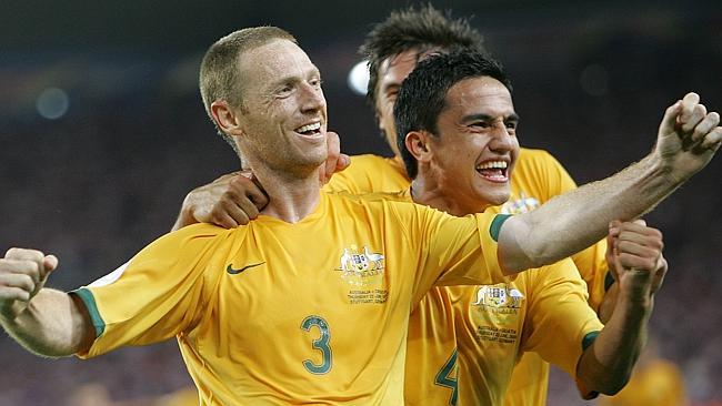 Former Socceroos captain Craig Moore celebrates with Tim Cahill after scoring against Croatia in the 2006 World Cup. 