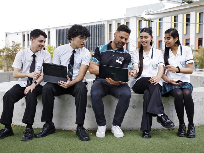 DAILY TELEGRAPH - 24/10/24Computer studies students from Oran Park HighSchool in Western Sydney pictured. L to R, Salvatore Tumminia, Hani Atieh (both starting year 12 now), Bojan Djoneski (computer teacher), Marwa Amir and Samiksha Thapar (both finishing HSC now). Picture: Sam Ruttyn