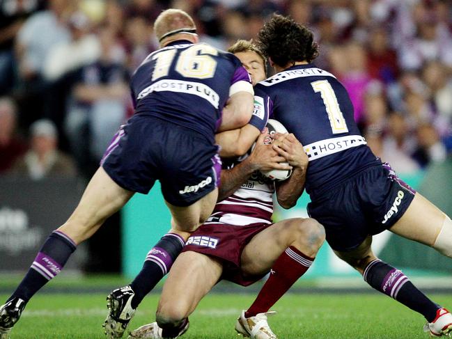 2007 NRL Grand Final. Melbourne Storm v Manly Sea Eagles. Telstra Stadium. Michael Crocker and Billy Slater sandwich Brett Stewart in this tackle