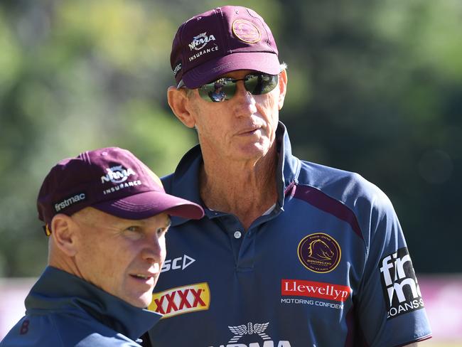 Brisbane Broncos coach Wayne Bennett speaks with coaching staff member Allan Langer (left) during a team training session at Red Hill in Brisbane, Wednesday, May 23, 2018. (AAP Image/Dave Hunt) NO ARCHIVING