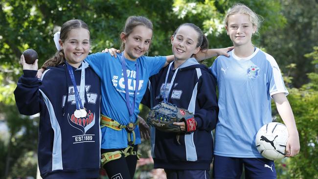 (L-R) Tayla Moore (athletics), Chloe Morris (rock climbing), Sophie Burnett (softball) and Kayla Osborn (football). Four Oakhill Drive Public School students have qualified for Australian championships in four different sports. Pictures: David Swift