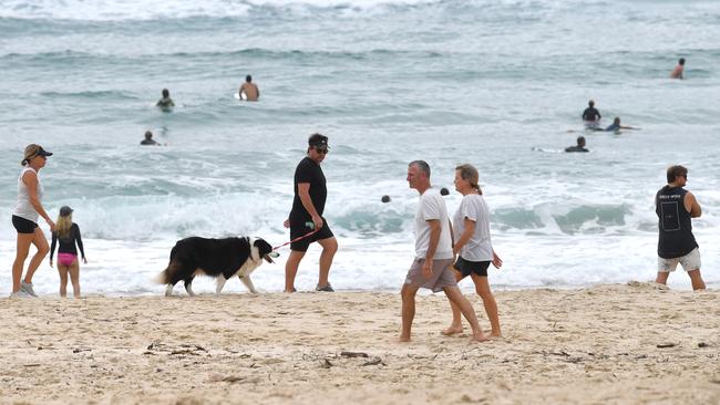 Despite pleas for people to stay at home and stop the spread ofcoronavirus, Burleigh Heads was packed on Friday morning. Picture: AAP/Darren England