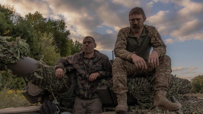 A Ukrainian crew take a break from operating a Soviet-made T-72 tank in the Sumy region. Picture: Roman Pilipey/AFP