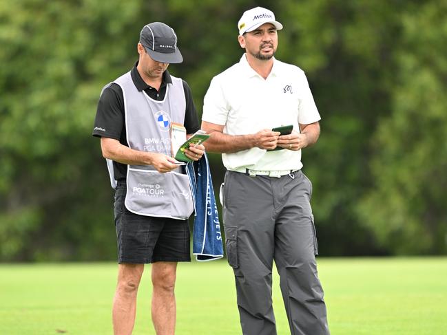 Jason Day of Australia alongside his caddie Luke Reardon as he prepares to play a shot on the sixth hole at Royal Queensland. Picture: Bradley Kanaris/Getty Images