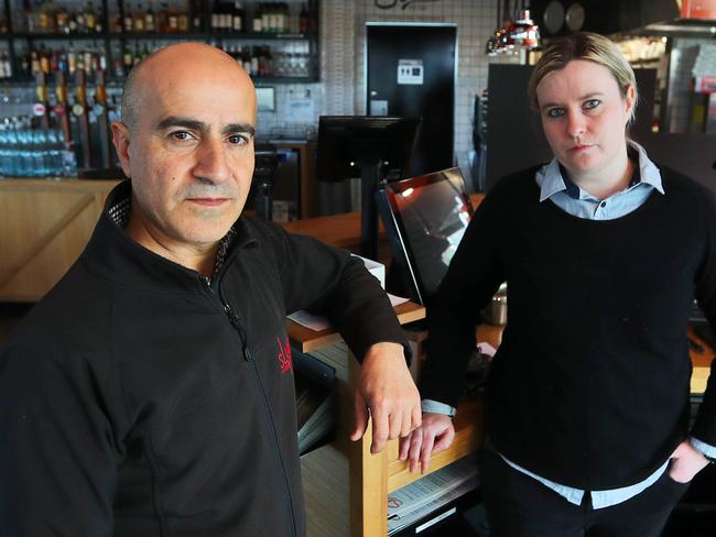 24/08/18 Slices Restaurant supervisor Ray Jalloul (left) with venue manager Melanie Ayres in their restaurant in Caroline Springs who was robbed by three underage offenders late on thursday night. Aaron Francis/The Australian