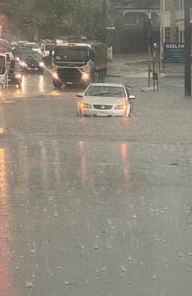 Car in flood waters on Latrobe terrace. Picture: Kate Crimmins, Facebook