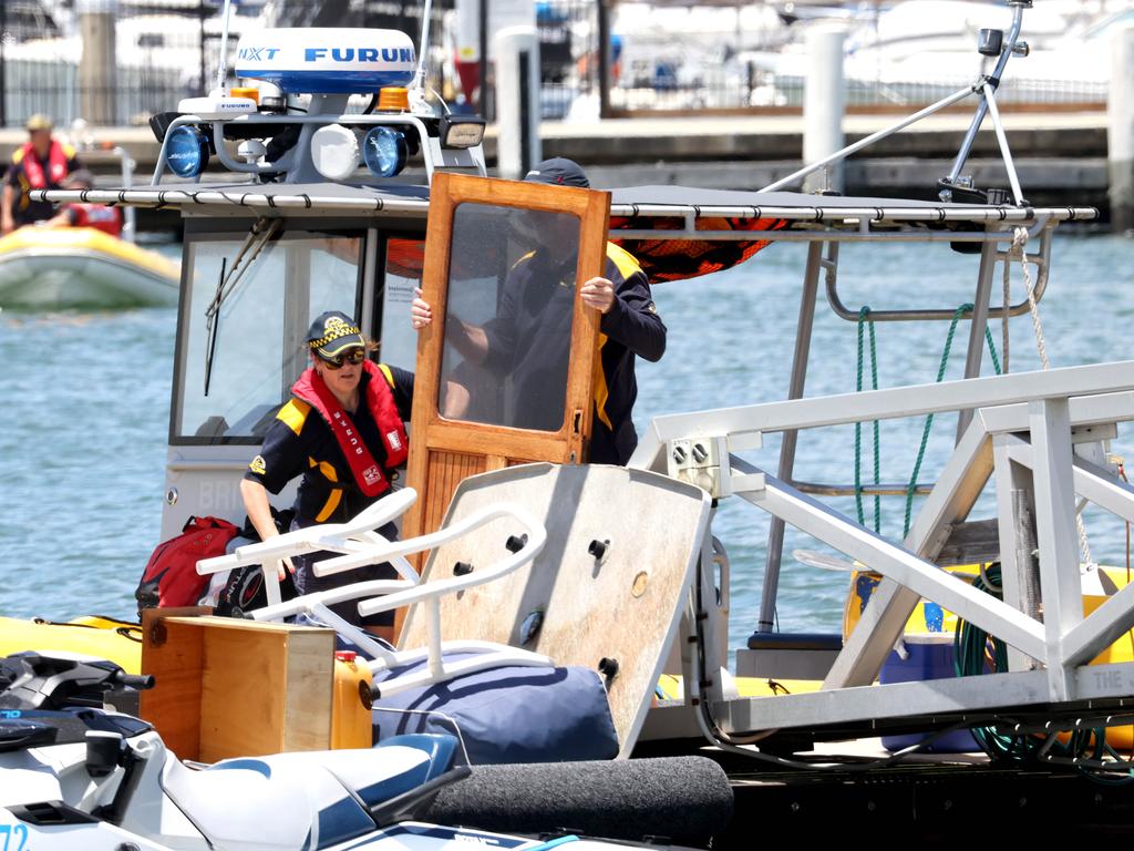 The Coast Guard returns with debris after a boat capsized in Moreton Bay. Picture: Steve Pohlner