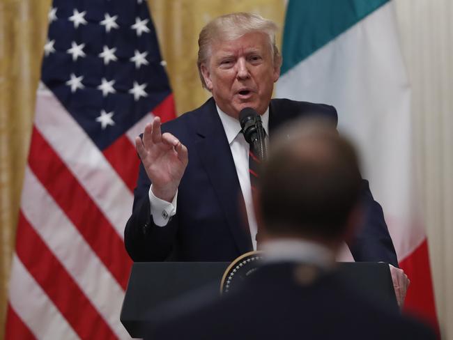 President Donald Trump gestures while answering a question at the White House. Picture: AP