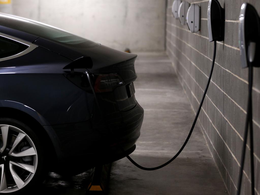 A Tesla Model Y charges at a EV charge station in Sydney. Australia has just four types of electric vehicles available – far less than other countries that have offered subsidies. Picture: Brendon Thorne/Getty Images