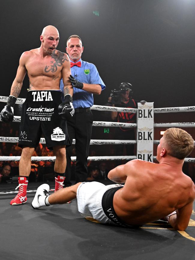 Mateo Tapia stands over Sergei Vorobiev. Pictures: No Limit Boxing/Gregg Porteous