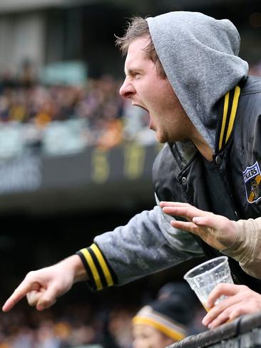 A Richmond fan gives it to the field umpire. Picture: Michael Klein