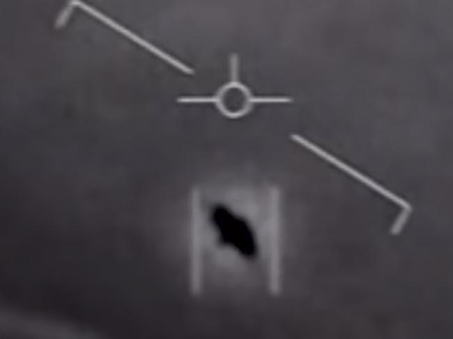 TOPSHOT - This video grab image obtained April 28, 2020 courtesy of the US Department of Defense shows part of an unclassified video taken by Navy pilots that have circulated for years showing interactions with "unidentified aerial phenomena". - The Pentagon has officially released three videos taken by US Navy pilots showing mid-air encounters with what appear to be UFOs. The grainy black and white footage had previously been leaked and the Navy had acknowledged they were Navy videos.The Department of Defense said April 27, 2020 it was "releasing the videos in order to clear up any misconceptions by the public on whether or not the footage that has been circulating was real, or whether or not there is more to the videos." (Photo by Handout / DoD / AFP) / RESTRICTED TO EDITORIAL USE - MANDATORY CREDIT "AFP PHOTO /US DEPARTMENT OF DEFENSE/HANDOUT " - NO MARKETING - NO ADVERTISING CAMPAIGNS - DISTRIBUTED AS A SERVICE TO CLIENTS