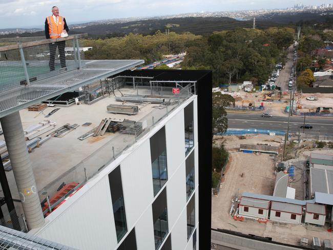 Minister for Health Brad Hazzard overlooking roadwork below the Northern Beaches Hospital. Picture: Damian Shaw