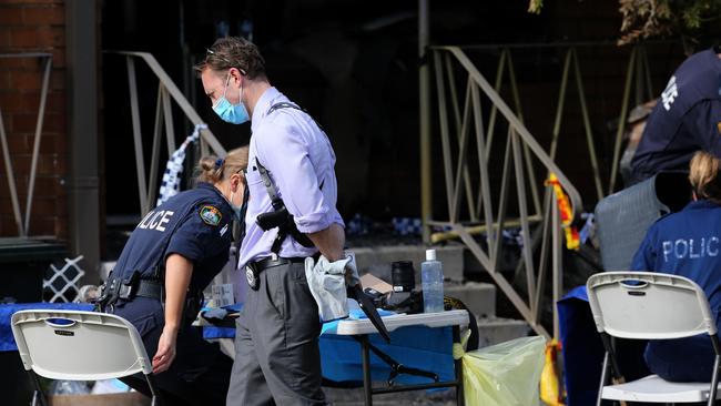 A police strike force has been set up to investigate the death of Stockton man Graham Cameron. Police continue to search the burnt out unit and surrounds looking for evidence. Picture by Peter Lorimer.