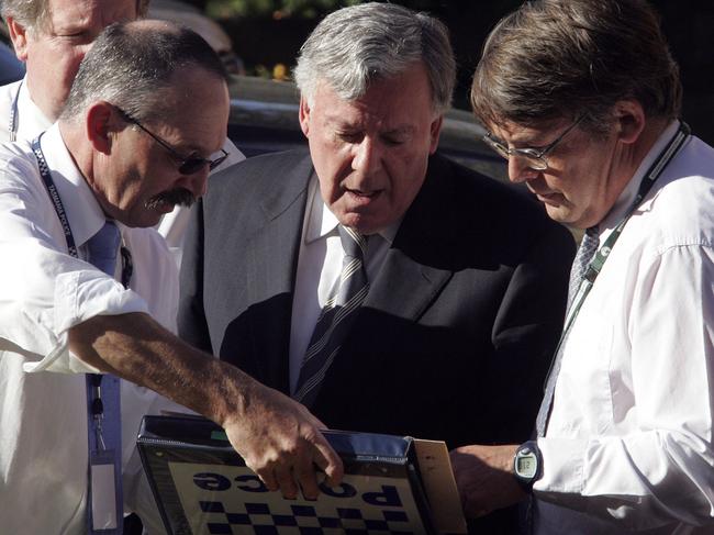 Dr Chris Lawrence, above right, with coroner’s associate John Morgan and coroner Peter Wilson, at the site of the Beaconsfield mine disaster, in April 2006. Picture: Chris Kidd