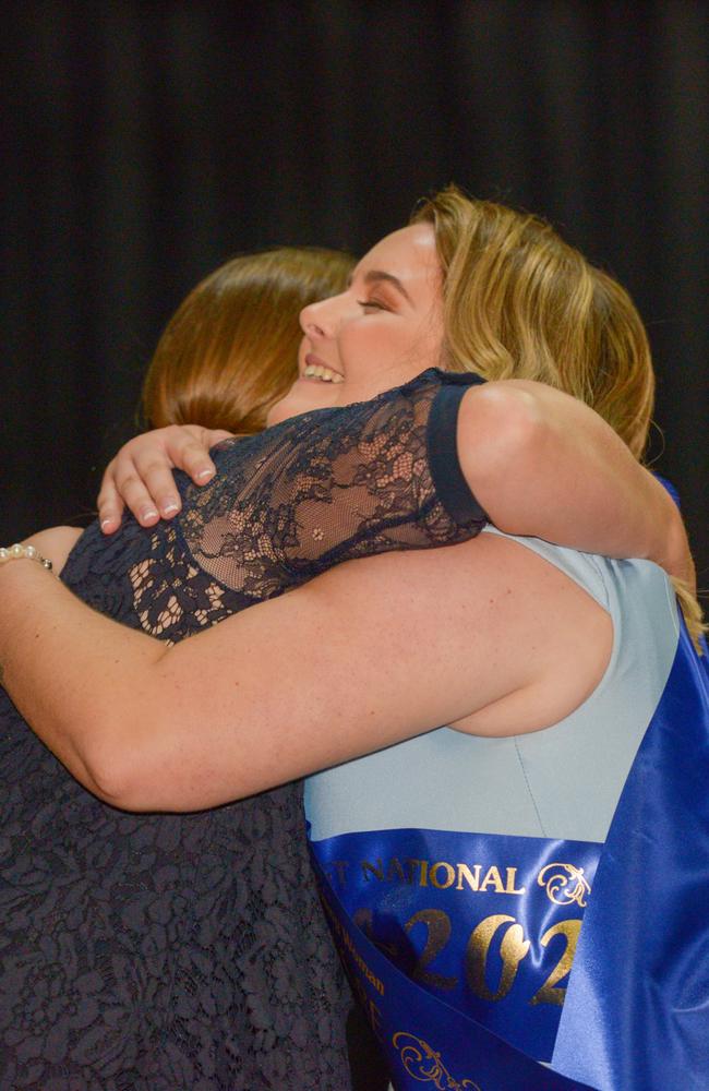 Director Mid-North Coast Shows Jody Nelson-Gleeson hugs winner of zone 1 in the final for Sydney AgShow Young Woman 2022, Lismore finalist Jenna Robinson, at the Lismore Workers Club.