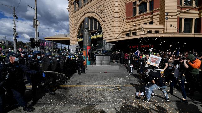 Protesters are pepper sprayed by police during an anti-lockdown protest last month in Melbourne's CBD. Picture: AAP