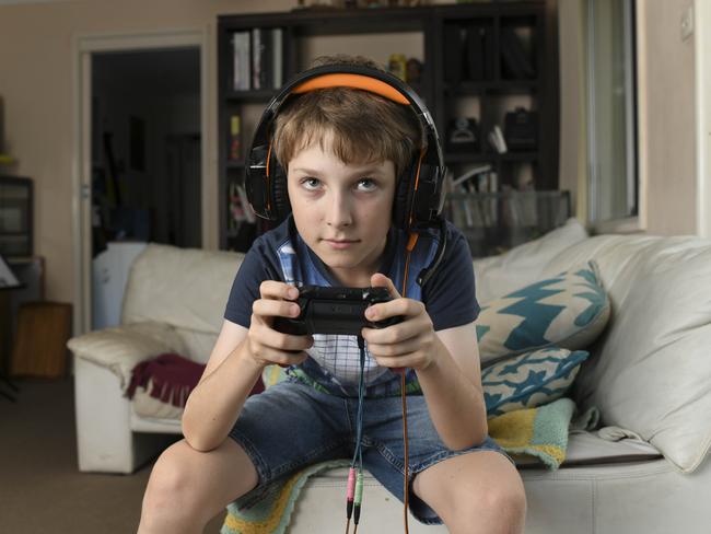 Tom Benhiam, 11, is all obsessed with the Hunger Games-style video game Fortnite: Battle Royale. Picture: Darren Leigh Roberts