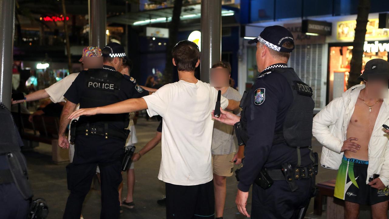 Police wanding revellers in Surfers Paradise. New laws will soon give police the same power in other party precincts. Picture: Richard Gosling