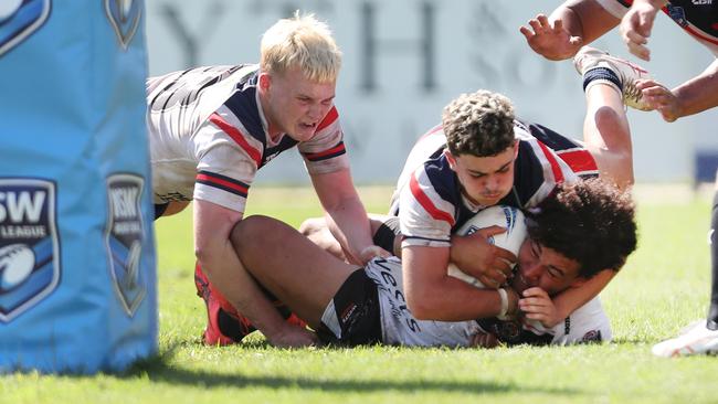 The Roosters’ goal line defence holding on. Picture: Sue Graham