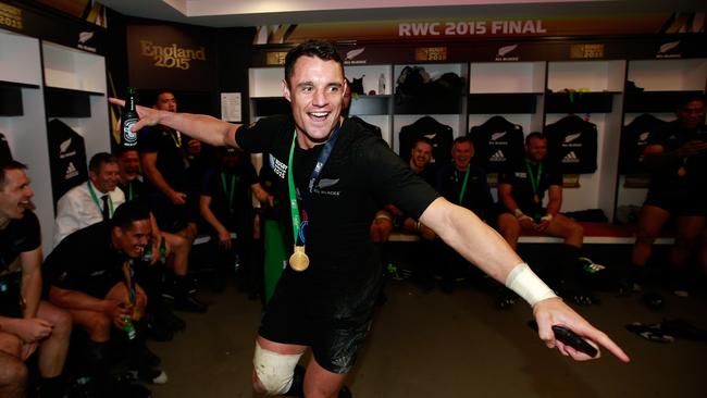 Dan Carter of New Zealand celebrates in the dressing room following victory in the 2015 Rugby World Cup final.