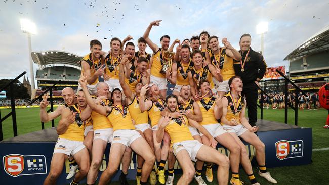 Tigers players celebrate after winning the SANFL Grand Final match between Norwood and Glenelg at Adelaide Oval. Picture: David Mariuz/SANFL Image