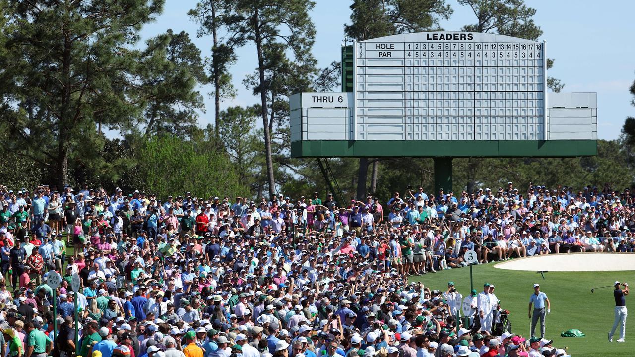 Tiger Woods of the United States plays his shot in front of an insane crowd