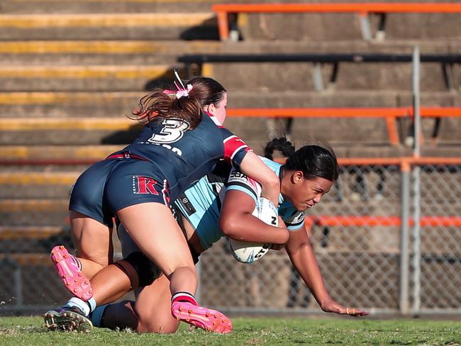 Faith Vili being pulled down by Elizabeth McGregor. Picture: Adam Wrightson Photography.