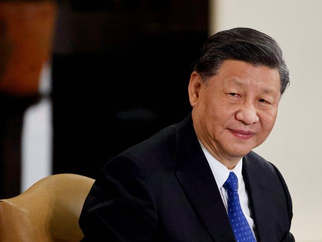 Chinese President Xi Jinping meets with French President Emmanuel Macron on the sidelines of the G20 Summit in Nusa Dua on the Indonesian resort island of Bali on November 15, 2022. (Photo by Ludovic MARIN / POOL / AFP)