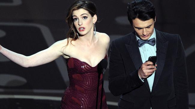 James Franco and Anne Hathaway present the 83rd Annual Academy Awards. Picture: AFP / GABRIEL BOUYS