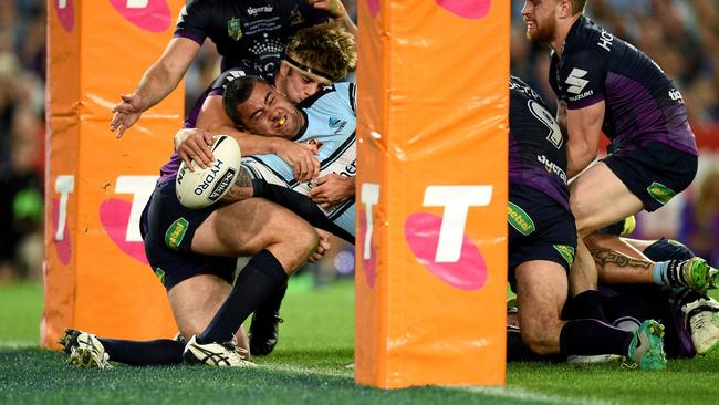 Andrew Fifita reaches out to score the match-winning try for Cronulla.