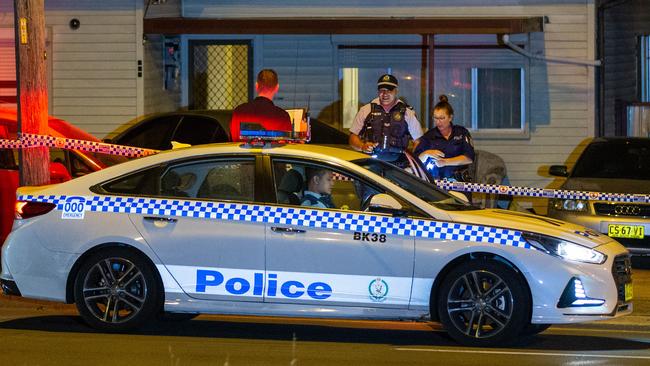 Police officers at the house where shots were fired. Picture: Dean Asher.