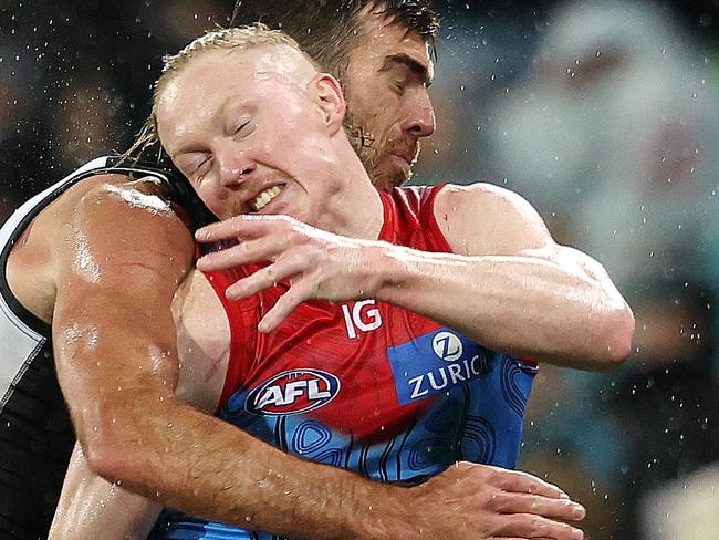 ADELAIDE, AUSTRALIA - MAY 19: Clayton Oliver of the Demons and Scott Lycett of the Power during the 2023 AFL Round 10 match between Yartapuulti/Port Adelaide Power and Narrm/Melbourne Demons at Adelaide Oval on May 19, 2023 in Adelaide, Australia. (Photo by Sarah Reed/AFL Photos via Getty Images)