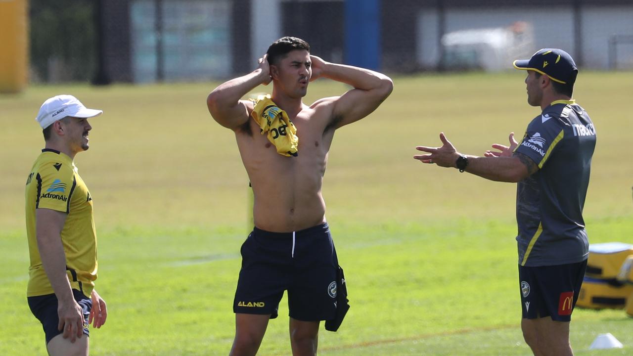 Daily Telegraph May 3/22 . Eels players warm up before training at Kellyville today . Player Dylan Brown no shirt on the field. Picture John Grainger